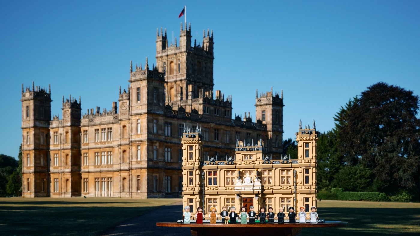 LEGO Downton Abbey 21373 model in front of Highclere Castle