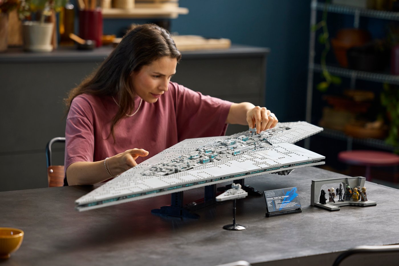 A builder beside the large LEGO Executor Super Star Destroyer 75457