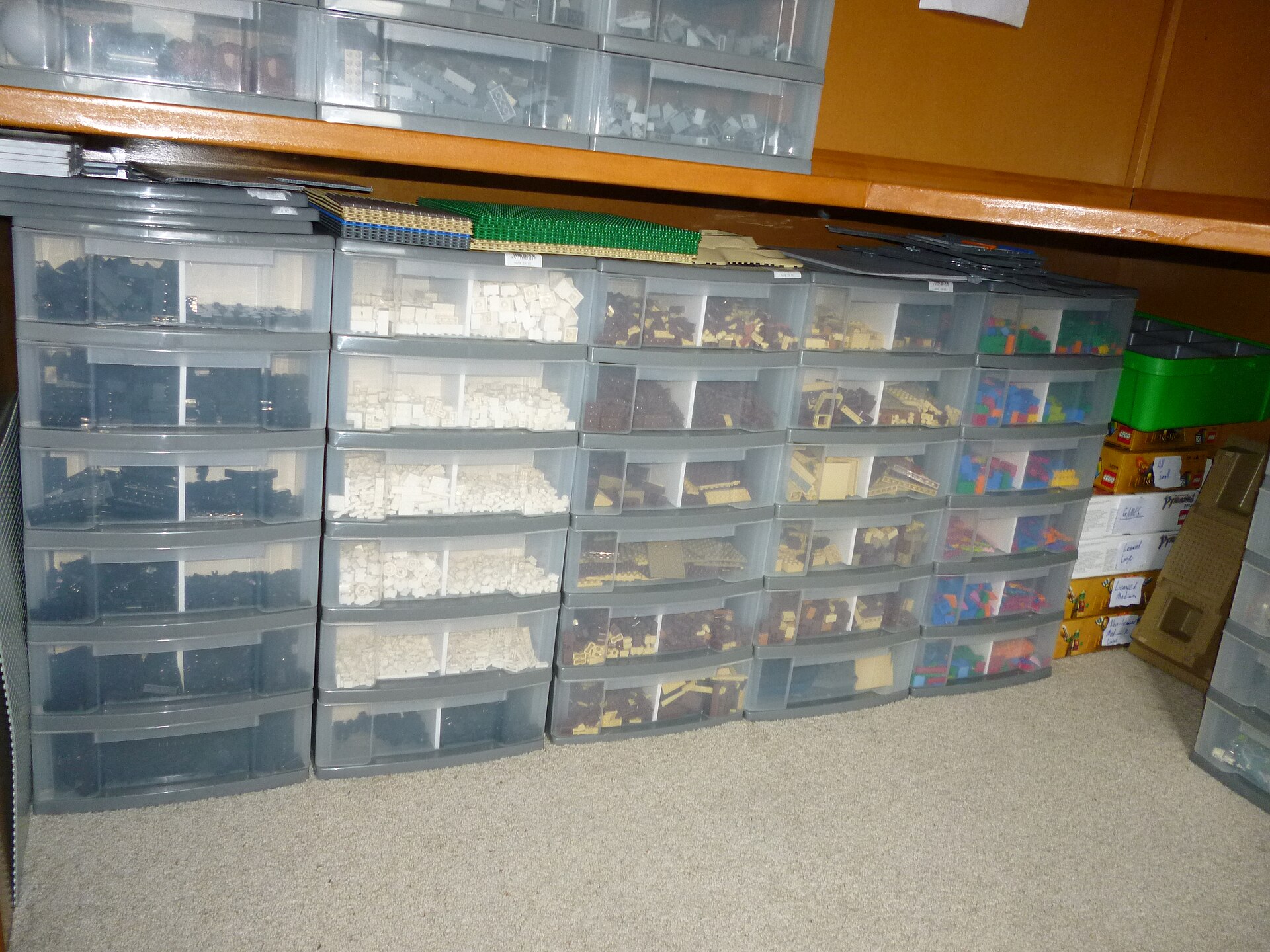 Transparent storage drawers organized with LEGO parts