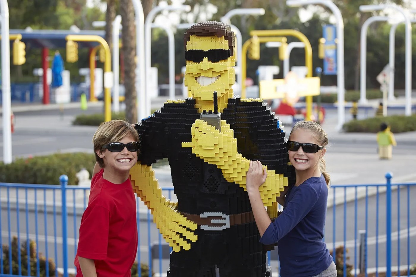 Visitors beside a LEGO police officer in LEGO City at LEGOLAND Korea